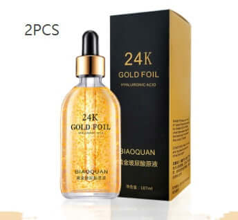 24K gold foil hyaluronic acid serum in clear bottle with dropper next to its packaging box