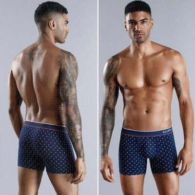 Man modeling blue polka-dot boxer briefs showcasing front and rear views, with a focus on fit and design for men's cotton underwear.