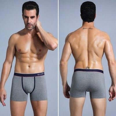 Man in gray cotton boxer briefs showcasing both front and back views, suitable for plus size, middle-waisted design.