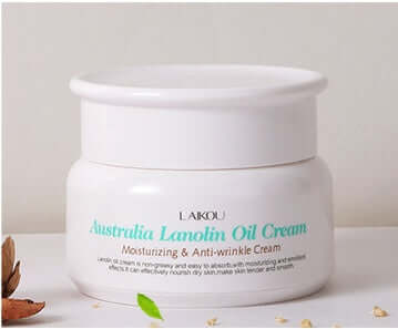 Jar of Australia Lanolin Oil Cream, labeled moisturizing and anti-wrinkle, displayed on a neutral background with dried leaves.