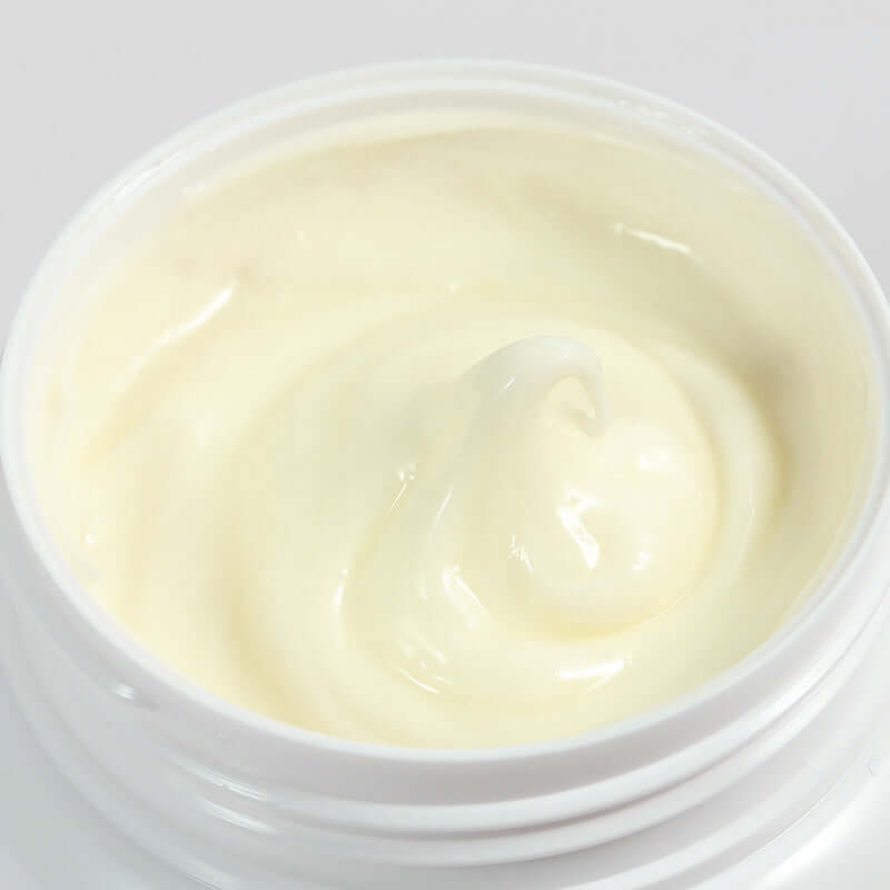 Close-up view of Lanolin Cream Moisturizing Lotion in container, highlighting its smooth texture for skin care.