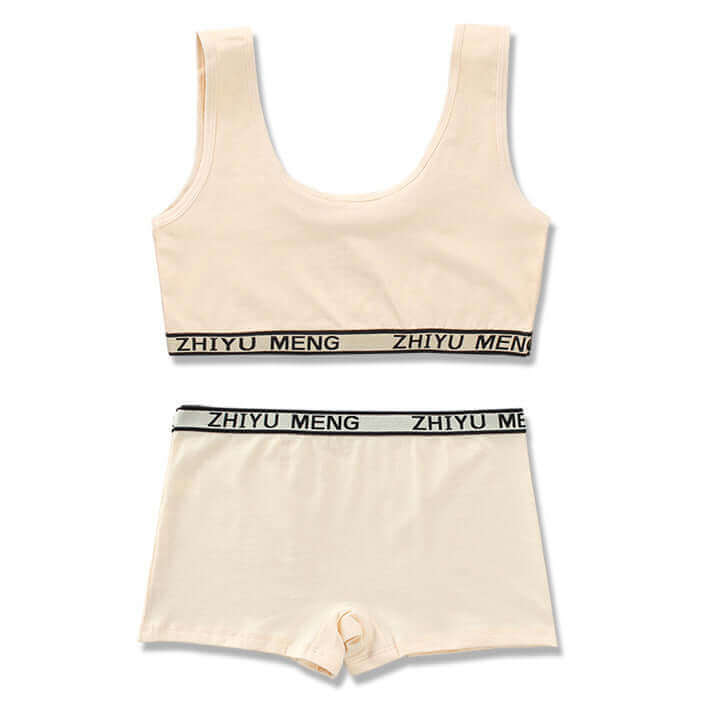 Cotton kids' underwear set in cream color featuring vest style top and shorts with branded elastic bands.