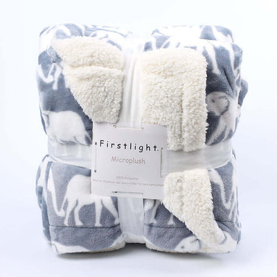 Thick polyester microplush blanket with imitation lambskin design and plant flower pattern, packaged and labeled 'Firstlight', suitable for cold indoor environments.