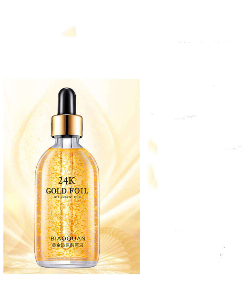 24K gold foil skin care serum in clear bottle against golden swirl background, highlighting moisturizing and firming properties.